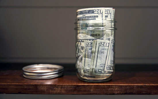 Business Nerdwallet Tools And Tactics To Do Your Own Financial - a canning jar filled with money sits on a shelf june 15 in east derry new hampshire the idea of having enough money to hire a !   financial adviser seems like